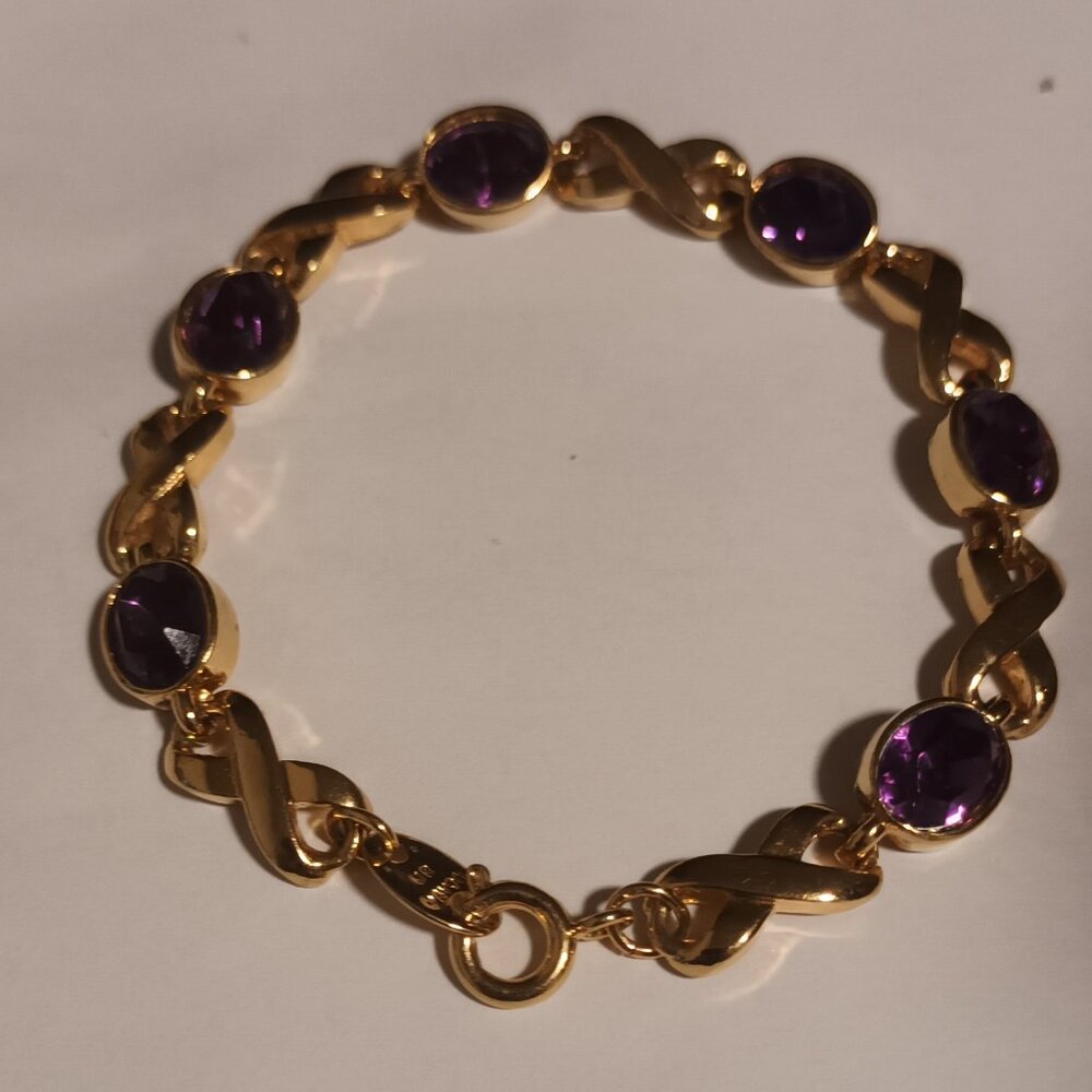 INFINITY BRACELET AVON GOLDTONE LEMINSCATE PURPLE OVAL